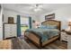Bright bedroom featuring a comfortable bed, a window view, and matching furniture at 1221 Alameda S Dr, Lakeland, FL 33805