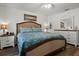 Cozy bedroom with a comfortable bed, warm lighting, and a stylish dresser at 1221 Alameda S Dr, Lakeland, FL 33805