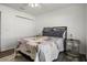 Comfortable bedroom with a queen-size bed, wooden floors, and ample closet space at 1221 Alameda S Dr, Lakeland, FL 33805
