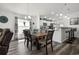 Dining area with adjacent open concept kitchen with barstool seating at 1221 Alameda S Dr, Lakeland, FL 33805