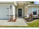 Charming front entrance featuring a decorative wreath and stone accents at 1221 Alameda S Dr, Lakeland, FL 33805