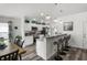 Stylish kitchen featuring white cabinets, granite countertops, and modern appliances at 1221 Alameda S Dr, Lakeland, FL 33805