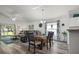Open living room and dining area featuring sliding glass doors to a back patio at 1221 Alameda S Dr, Lakeland, FL 33805