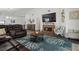 Spacious living room with a fireplace, hardwood floors, and stylish furniture at 1221 Alameda S Dr, Lakeland, FL 33805
