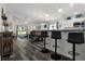 Open-concept living space with barstool seating, dining, and great natural light at 1221 Alameda S Dr, Lakeland, FL 33805