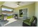 Relaxing covered patio with comfortable seating and outdoor grilling area at 1221 Alameda S Dr, Lakeland, FL 33805