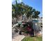 Outdoor deck with nautical decor and a partial view of an above-ground pool in the backyard at 124 Palm Pl, Haines City, FL 33844