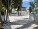 This property features a backyard with a hammock, palm trees, and an above-ground pool at 124 Palm Pl, Haines City, FL 33844