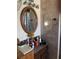 Bathroom area featuring tile walls, and vanity with flowers and mirror at 124 Palm Pl, Haines City, FL 33844