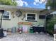 A patio with unique decor including string lights, metal art, and a Landshark Lager sign at 124 Palm Pl, Haines City, FL 33844