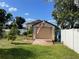 View of the shed and American flag, providing extra storage space and outdoor charm at 124 Palm Pl, Haines City, FL 33844