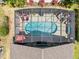 Aerial view of screened-in pool with patio and lounge furniture at 1357 Rebecca Dr, Haines City, FL 33844