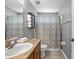 Bathroom with neutral colors, a vanity, a sink, and a shower with a patterned curtain at 1357 Rebecca Dr, Haines City, FL 33844