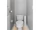 Neutral-toned bathroom featuring a standard white toilet and tile flooring for a clean, simple look at 1357 Rebecca Dr, Haines City, FL 33844