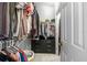 Walk-in closet with ample hanging space, shelving, and drawers for organized storage at 1357 Rebecca Dr, Haines City, FL 33844