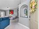 Inviting foyer with an archway leading into the living room; stylish décor with tile flooring at entrance at 1357 Rebecca Dr, Haines City, FL 33844
