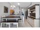 Open kitchen and dining area with bench seating and modern lighting at 1357 Rebecca Dr, Haines City, FL 33844