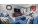Comfortable living room with neutral gray walls, a large television, and comfortable seating at 1357 Rebecca Dr, Haines City, FL 33844