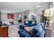 Spacious living room featuring high ceilings, neutral paint, and comfortable blue furniture set at 1357 Rebecca Dr, Haines City, FL 33844