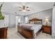 Primary bedroom featuring a king-size bed and a ceiling fan at 1357 Rebecca Dr, Haines City, FL 33844