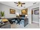 Neutral-toned office with large desk area, complemented by artwork and office essentials at 1357 Rebecca Dr, Haines City, FL 33844
