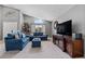 Bright sitting room featuring neutral paint, large windows, and comfortable chairs at 1357 Rebecca Dr, Haines City, FL 33844