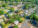 Expansive aerial view of the neighborhood, surrounded by lush greenery and mature trees at 1371 Sheridan Sw St, Winter Haven, FL 33880