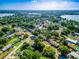 Wide aerial view showing homes, green spaces, and lakes creating a picturesque landscape at 1371 Sheridan Sw St, Winter Haven, FL 33880