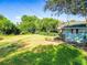 Spacious, sunny backyard with lush green grass, perfect for outdoor activities at 1371 Sheridan Sw St, Winter Haven, FL 33880