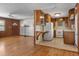 Open-concept kitchen seamlessly connects to the living area with nice flooring at 1371 Sheridan Sw St, Winter Haven, FL 33880
