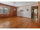 Bright living room showcasing beautiful hardwood floors, vintage lighting, and modern updates at 1371 Sheridan Sw St, Winter Haven, FL 33880