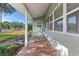 The home has a quaint, covered front porch with red terracotta style tile at 1371 Sheridan Sw St, Winter Haven, FL 33880