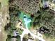 A bird's-eye view of the property highlights the lot size, home layout, and surrounding lush landscapes at 14 Cypress Run, Haines City, FL 33844