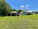 Beautifully landscaped backyard with a charming gazebo providing a serene retreat next to a home with lush surroundings at 14 Cypress Run, Haines City, FL 33844