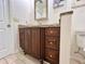 Bathroom featuring granite countertops, dark wood cabinets, and modern fixtures creating a comfortable space at 14 Cypress Run, Haines City, FL 33844