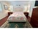 Cozy main bedroom features wood floors, stylish furniture and bright natural lighting at 14 Cypress Run, Haines City, FL 33844