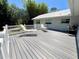 Decking area showcases a seating area with yard and landscaping views at 14 Cypress Run, Haines City, FL 33844