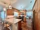 Beautiful kitchen featuring a breakfast bar, granite countertops, and hardwood floors at 14 Cypress Run, Haines City, FL 33844