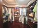 Spacious walk-in closet featuring custom shelving and ample storage for clothes and shoes at 14 Cypress Run, Haines City, FL 33844