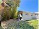 View of the side yard with lush bamboo providing shade and privacy to the property and home at 14 Cypress Run, Haines City, FL 33844