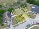 Aerial view of yellow home with well-maintained lawn and solar panels in a neighborhood at 147 Brookshire Dr, Lake Wales, FL 33898