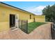 Enclosed backyard, featuring a brick pathway and a shed, providing privacy and functionality at 147 Brookshire Dr, Lake Wales, FL 33898