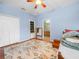 Light-filled bedroom featuring hard wood floors and en-suite access at 147 Brookshire Dr, Lake Wales, FL 33898