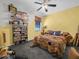 Cozy bedroom with lots of shelves, ceiling fan and quirky design elements at 147 Brookshire Dr, Lake Wales, FL 33898