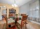 Dining room with ample seating, a glass table, and built in cabinet at 147 Brookshire Dr, Lake Wales, FL 33898