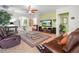 Inviting living room with comfortable seating, tile flooring, and stylish decor at 147 Brookshire Dr, Lake Wales, FL 33898