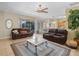 Spacious living room with tile floors, ceiling fan, and view to dining area at 147 Brookshire Dr, Lake Wales, FL 33898