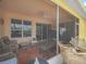 Screened patio perfect for outdoor relaxation and entertaining with a fan and comfortable seating at 147 Brookshire Dr, Lake Wales, FL 33898