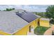 Aerial view highlighting the home's solar panels and backyard with a shed at 147 Brookshire Dr, Lake Wales, FL 33898