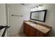 Bathroom with granite countertop vanity and updated fixtures at 150 El Dorado # 109, Winter Haven, FL 33884